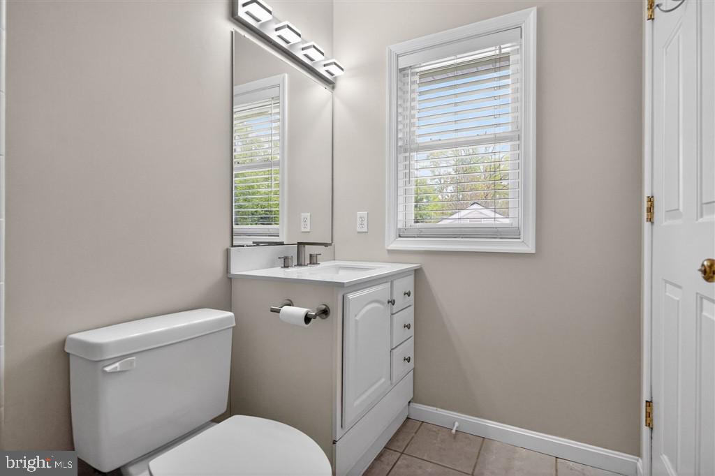 1604 Oriole Road Edgewater, MD 21037 - Photo 22 of 29 a bathroom with a toilet sink and window