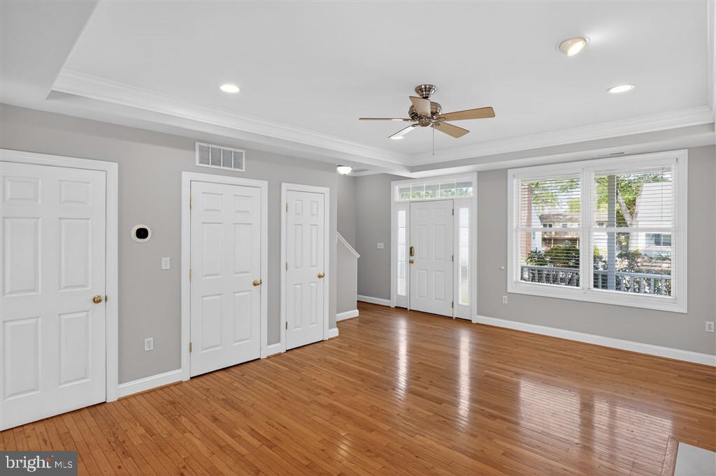 1604 Oriole Road Edgewater, MD 21037 - Photo 6 of 29 a view of an empty room with a window and wooden floor