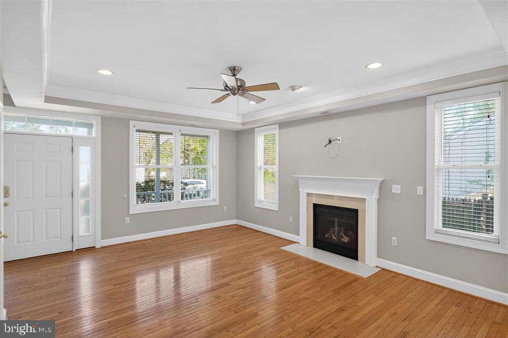 1604 Oriole Road Edgewater, MD 21037 - Photo 9 of 29 a view of an empty room with wooden floor and a window
