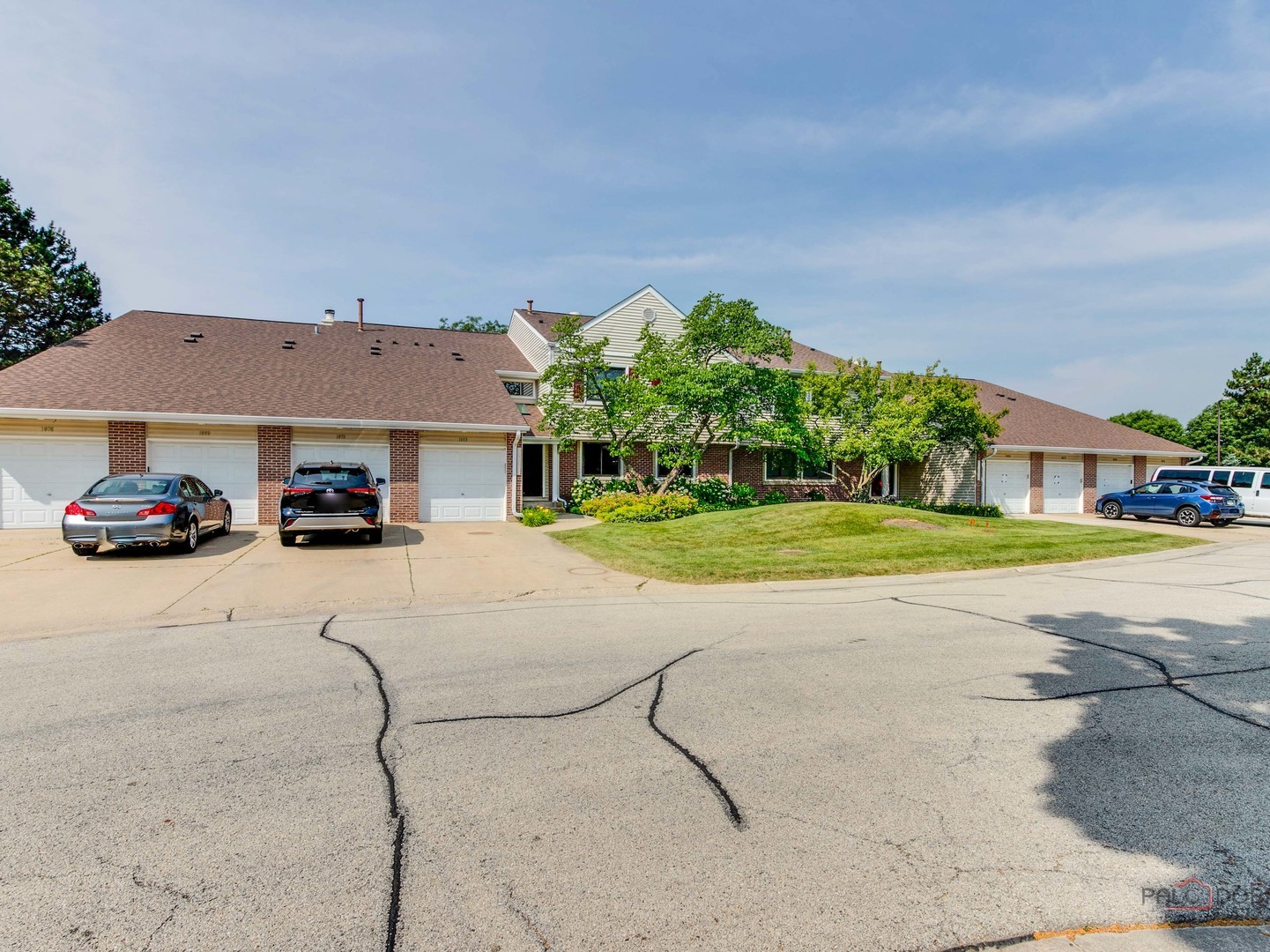 1082 Pine Tree Circle North, Unit 1082 Buffalo Grove, IL 60089 - Photo 1 of 26 a car parked in front of white house
