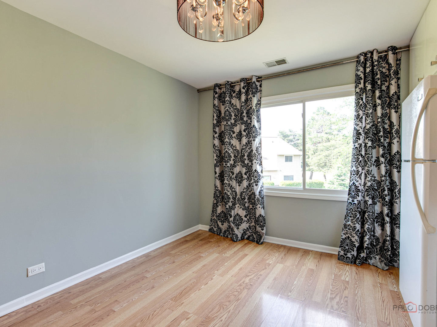 1082 Pine Tree Circle North, Unit 1082 Buffalo Grove, IL 60089 - Photo 15 of 26 wooden floor in an empty room with a window