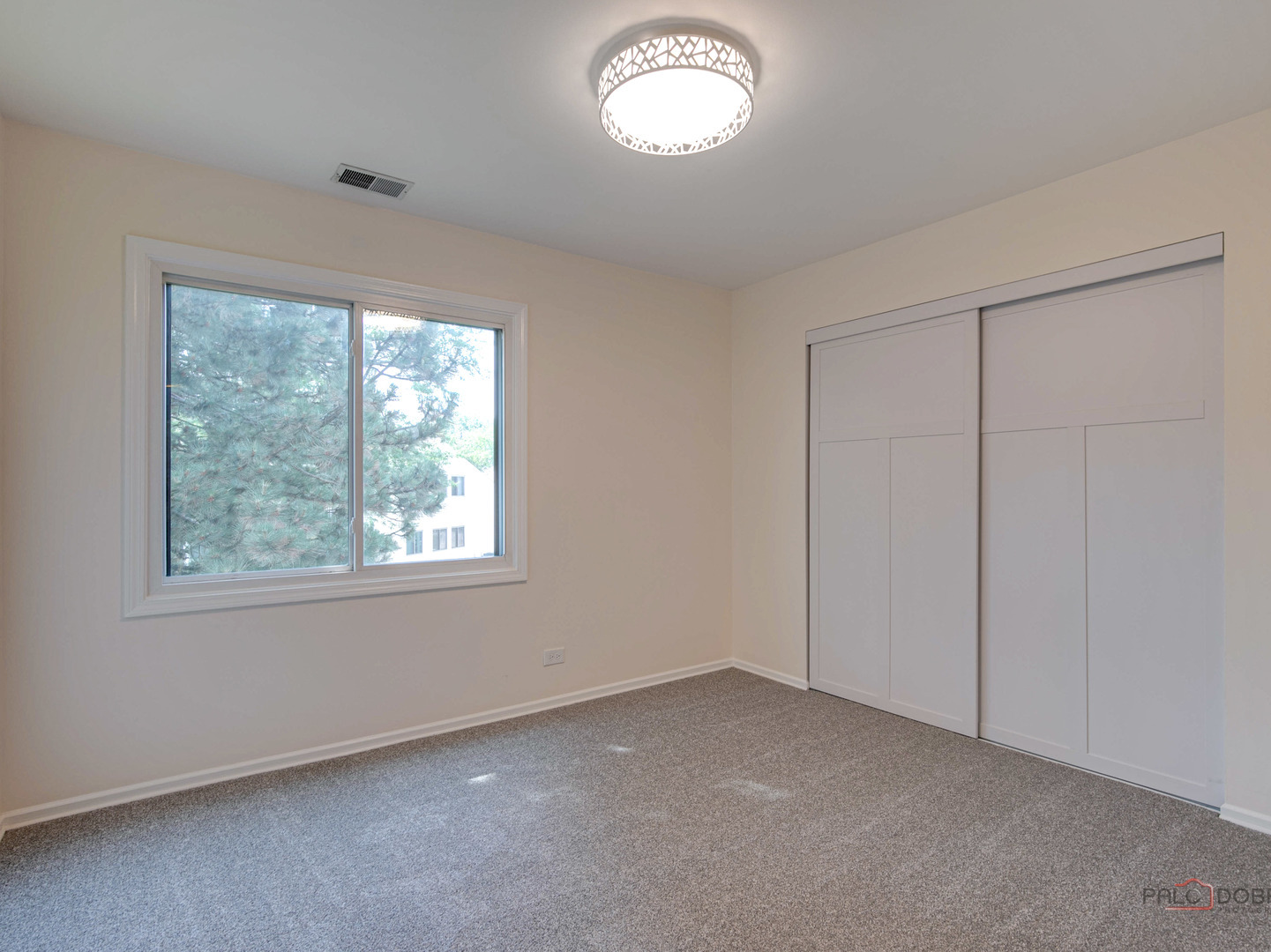 1082 Pine Tree Circle North, Unit 1082 Buffalo Grove, IL 60089 - Photo 19 of 26 an empty room with a window