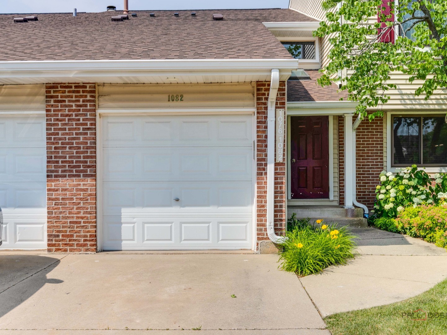 1082 Pine Tree Circle North, Unit 1082 Buffalo Grove, IL 60089 - Photo 2 of 26 a front view of a house