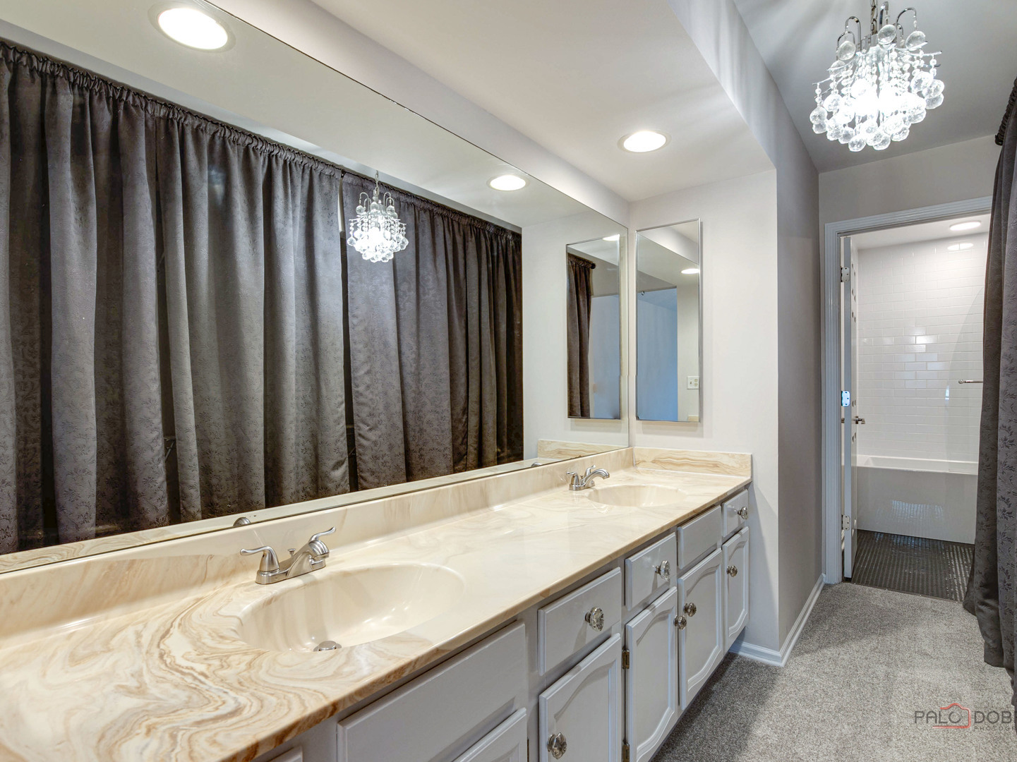 1082 Pine Tree Circle North, Unit 1082 Buffalo Grove, IL 60089 - Photo 22 of 26 a bathroom with double vanity sink and a mirror