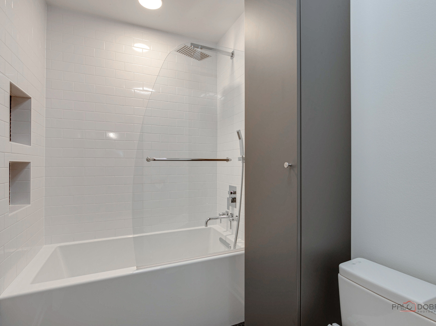 1082 Pine Tree Circle North, Unit 1082 Buffalo Grove, IL 60089 - Photo 23 of 26 a white bath tub sitting next to a toilet