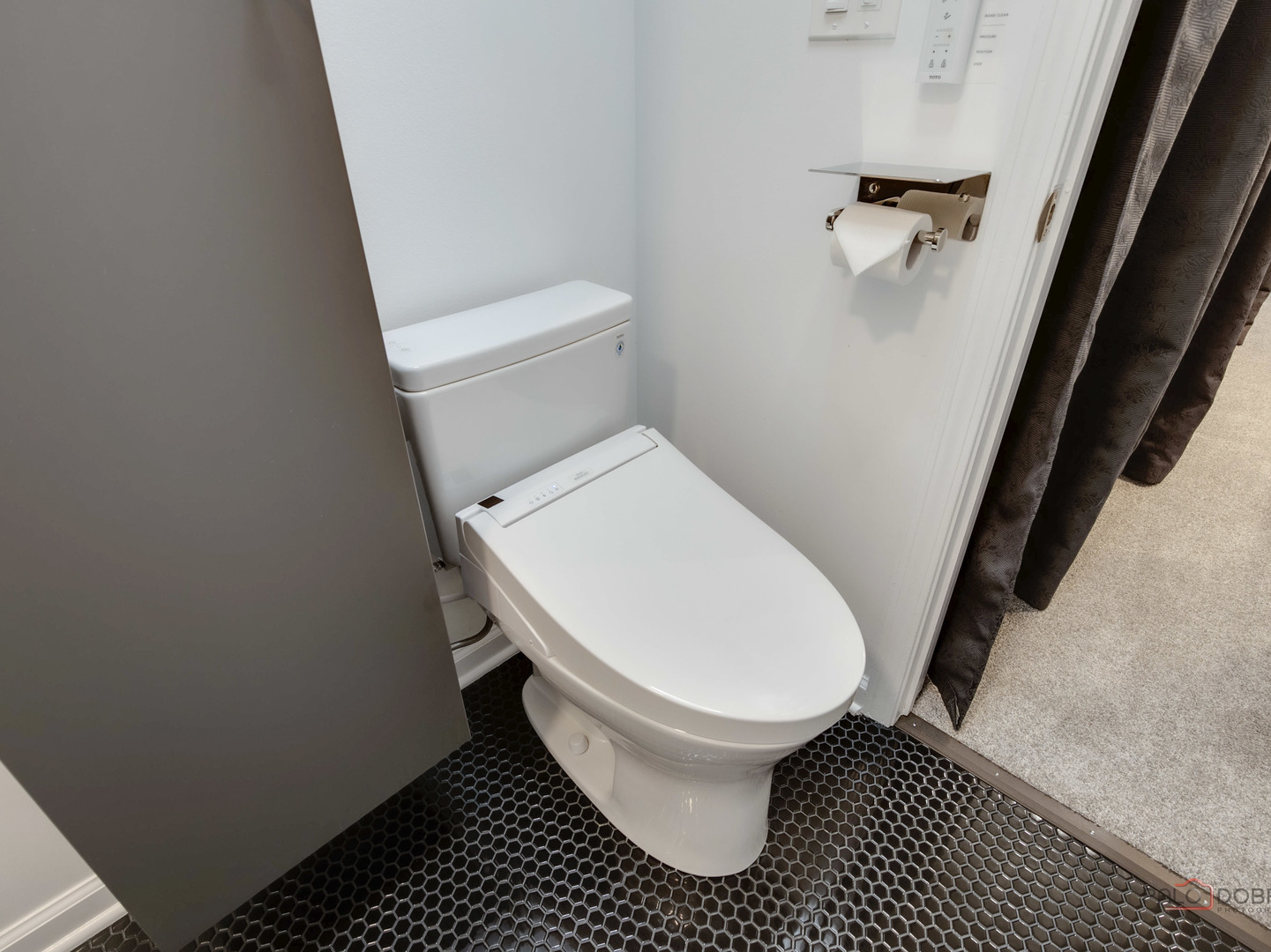1082 Pine Tree Circle North, Unit 1082 Buffalo Grove, IL 60089 - Photo 24 of 26 a white toilet sitting next to a sink