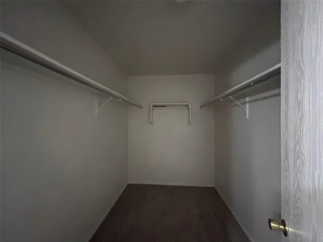 a bathroom with a granite countertop sink toilet a large mirror a bathtub and shower