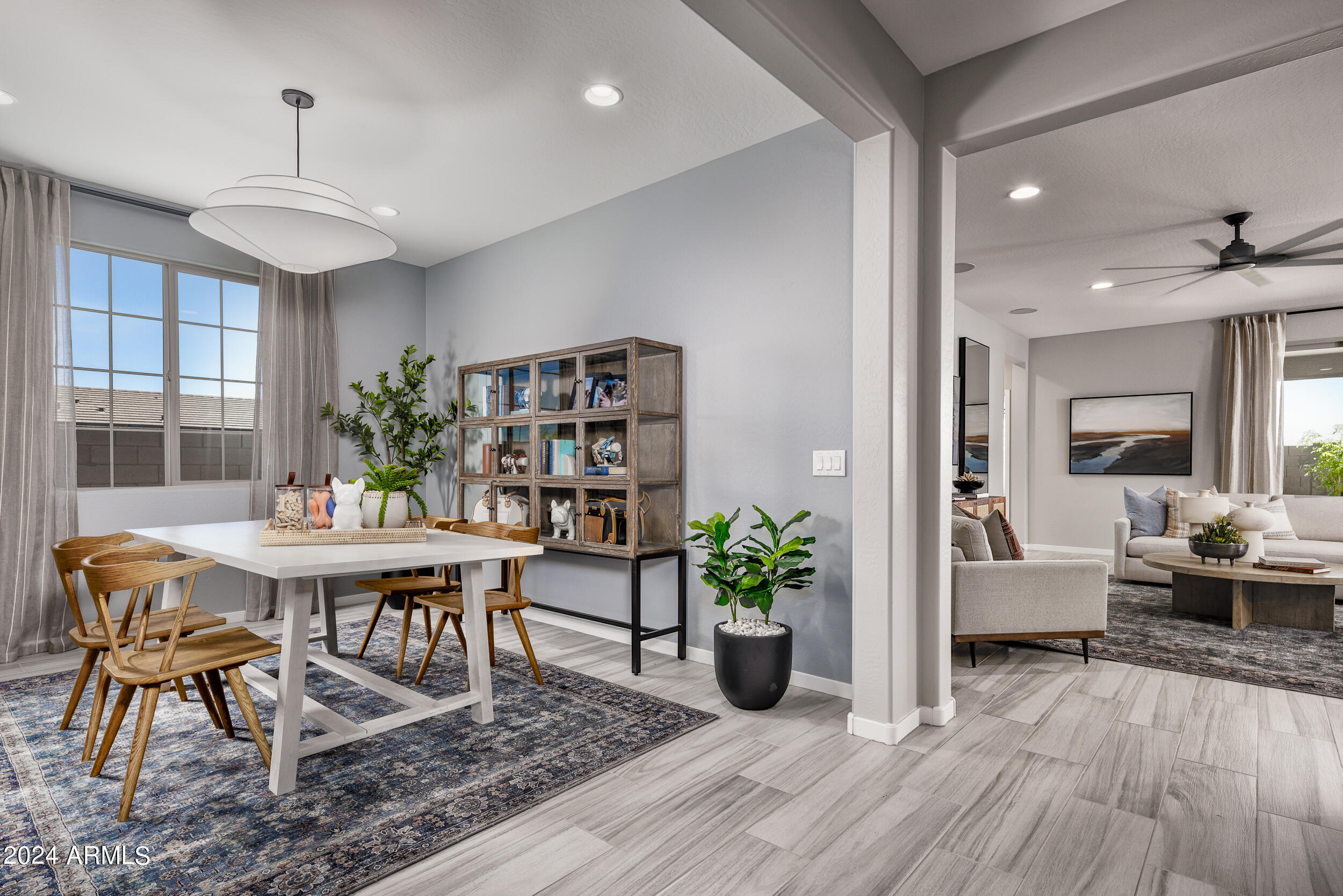 10274 South Dutchman Drive Apache Junction, AZ 85120 - Photo 8 of 45 a view of a dining room with furniture window and wooden floor