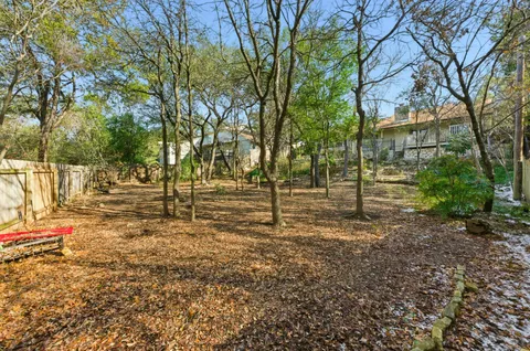 a backyard of a house with lots of green space