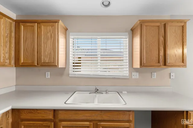 a view of an empty room with a ceiling fan