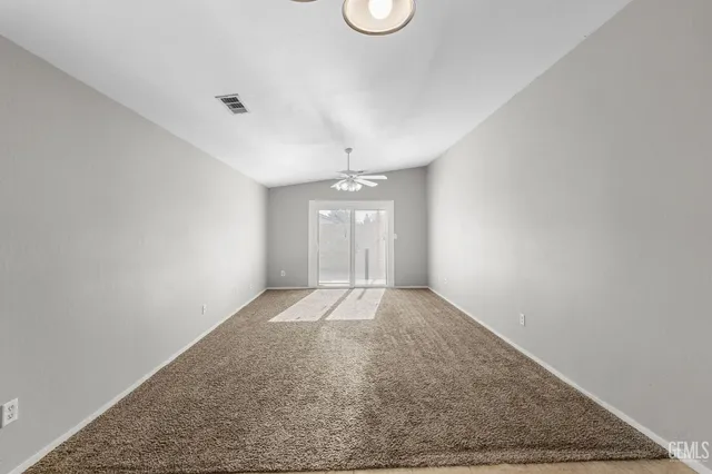 a bathroom with a shower a toilet and sink