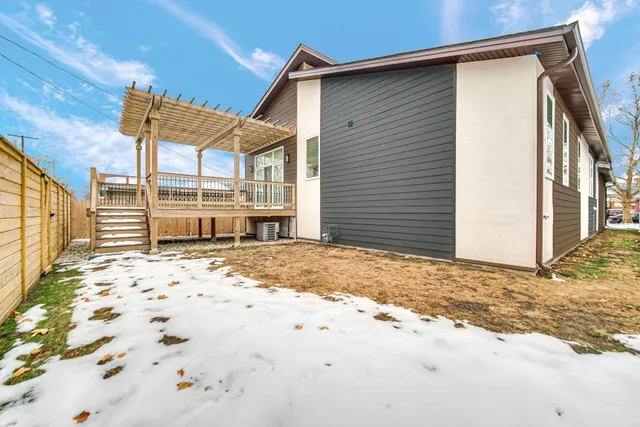 a view of a yard with a wooden fence