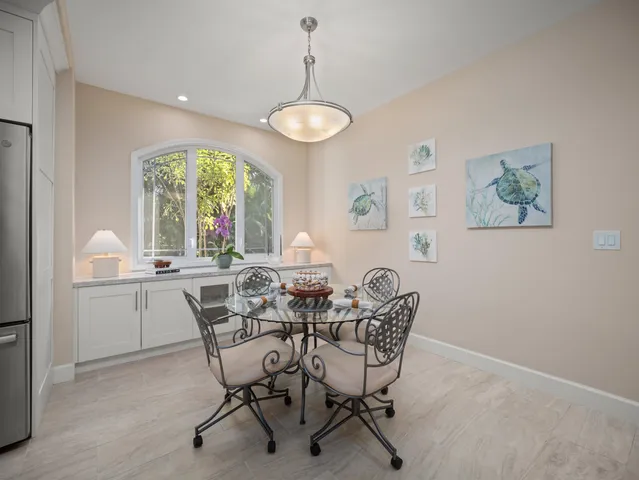 a view of a dining room with furniture window and outside view