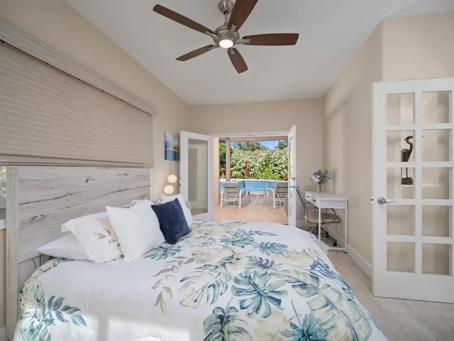 a bedroom with a large bed and a couch