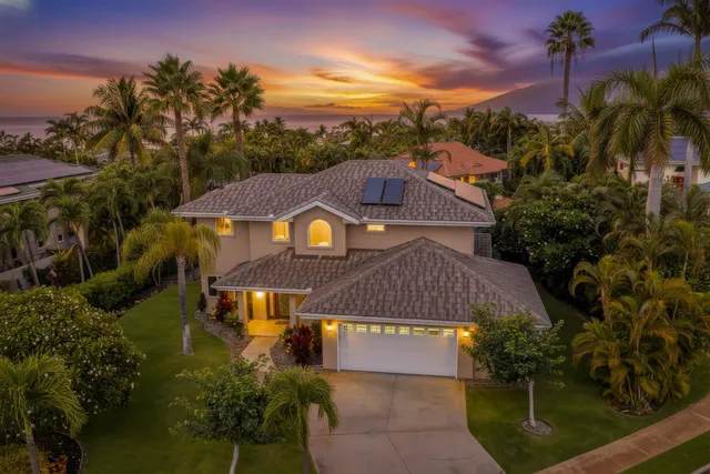 a aerial view of a house with a yard