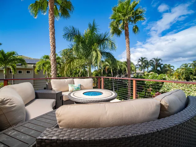 a view of a couches and a table in the patio