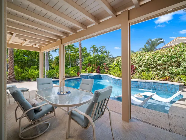 a view of an outdoor dining space with furniture