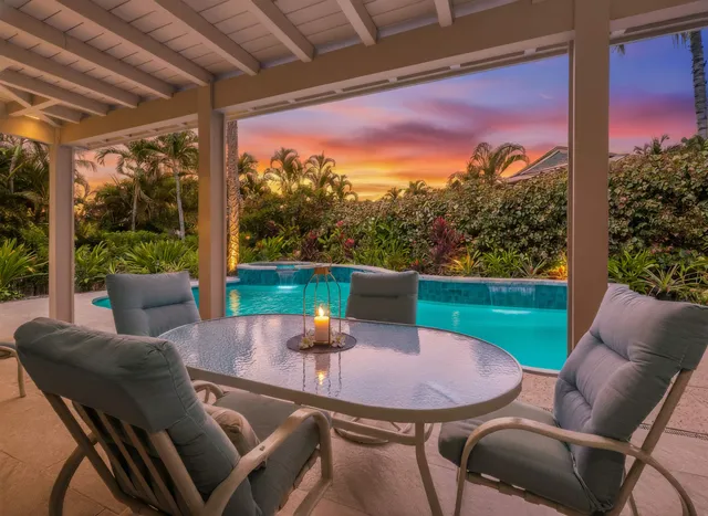 a view of a patio with a table chairs and a table