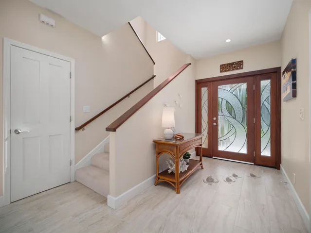 a view of an entryway with wooden floor