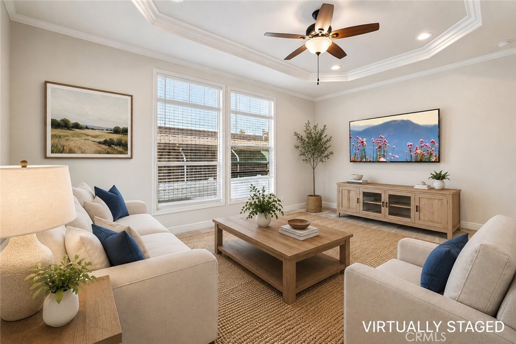 250 East Telegraph Road, Unit 307 Fillmore, CA 93015 - Photo 5 of 36 a living room with furniture a fireplace and a flat screen tv