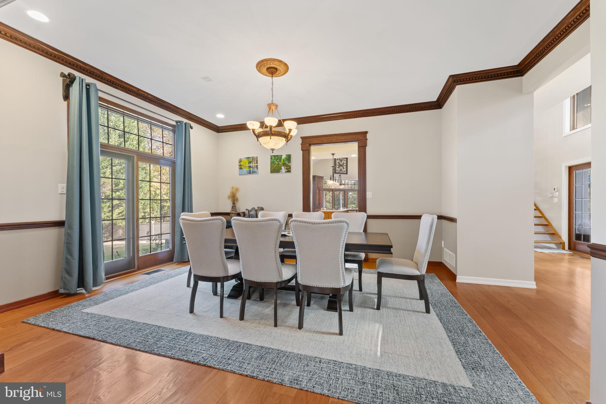 244 Mathers Road Ambler, PA 19002 - Photo 14 of 52 a dining room with furniture a chandelier and wooden floor