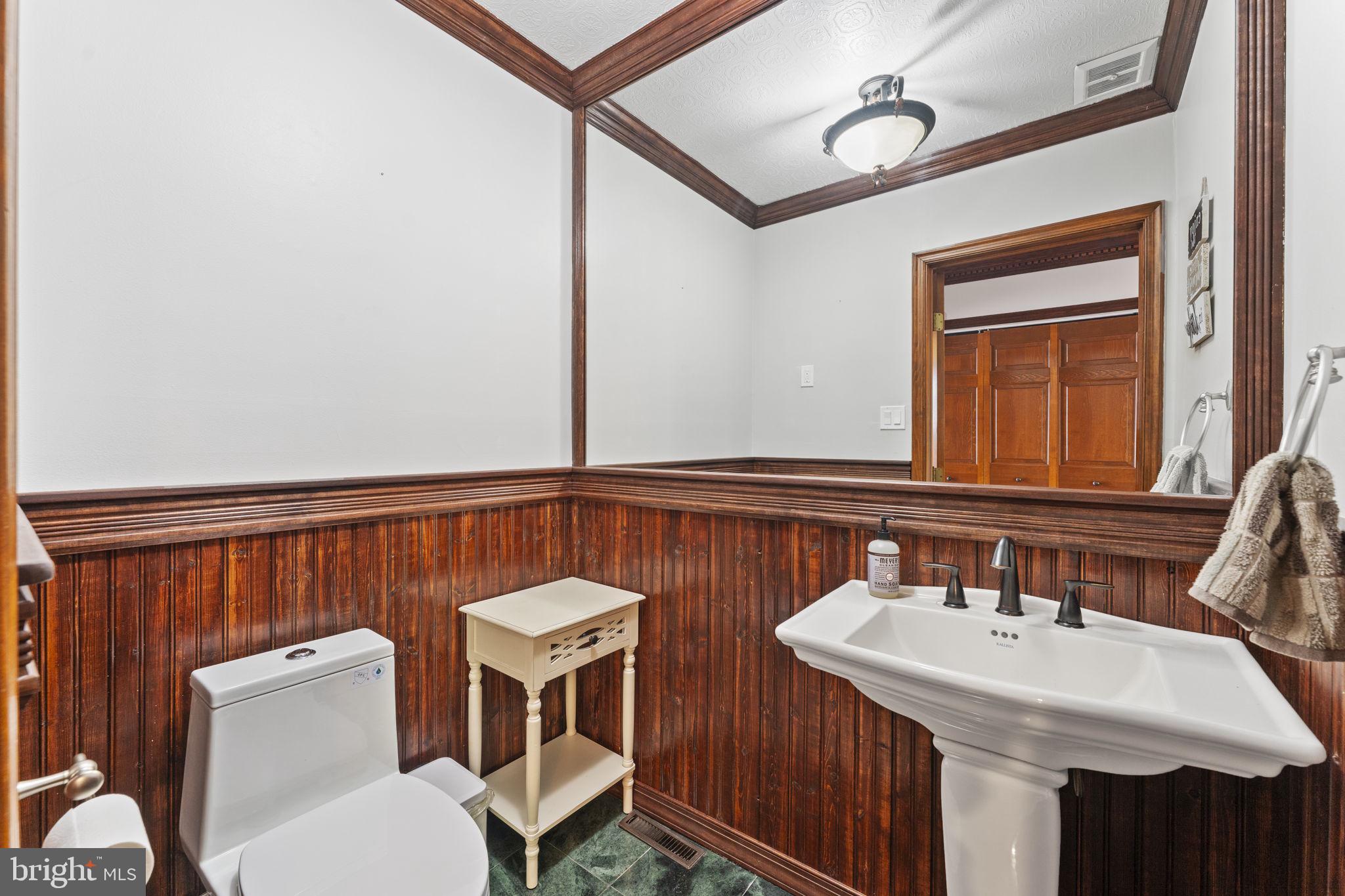 244 Mathers Road Ambler, PA 19002 - Photo 25 of 52 a bathroom with a sink a toilet and mirror