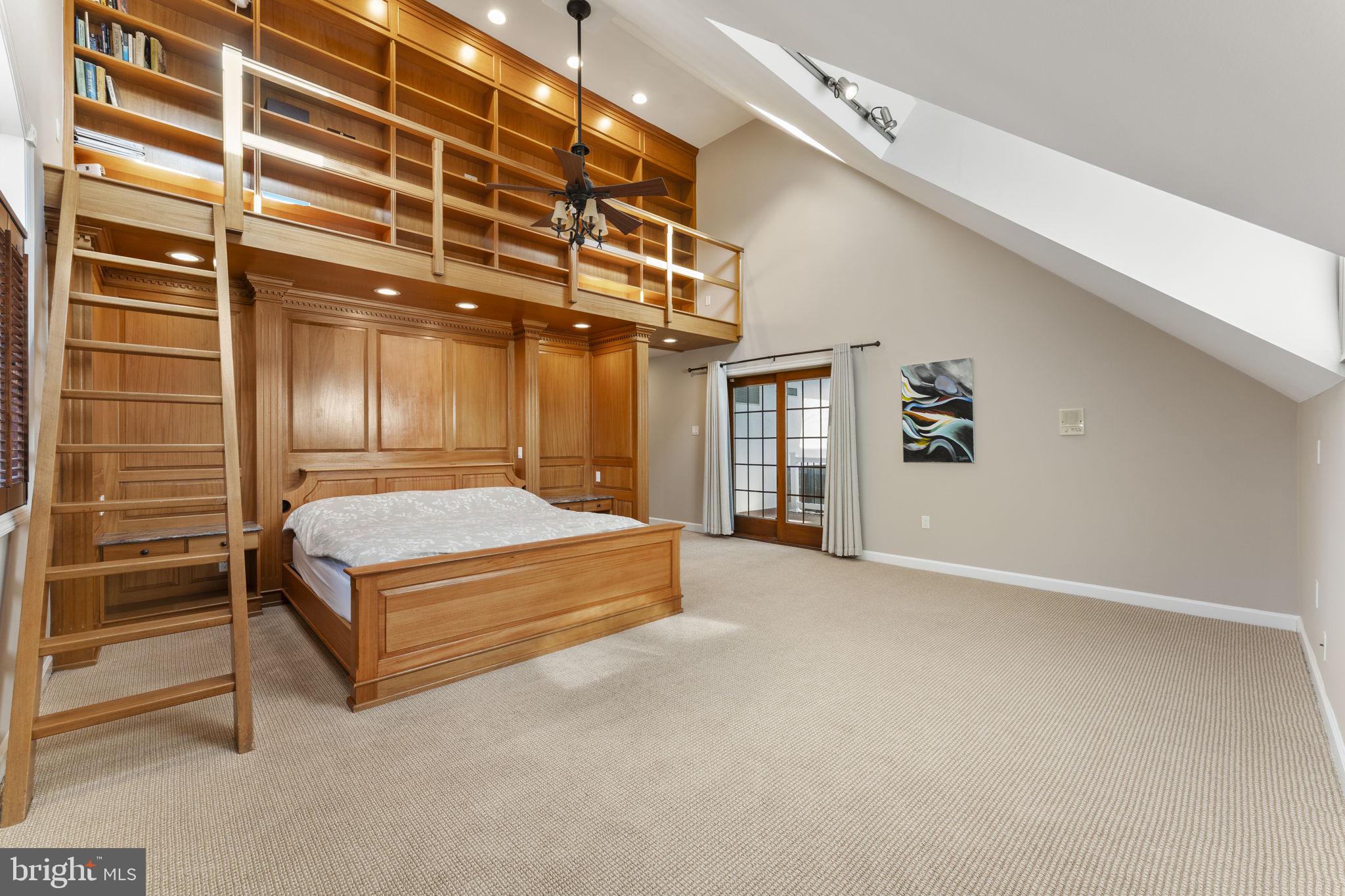 244 Mathers Road Ambler, PA 19002 - Photo 26 of 52 a spacious bedroom with a bed and a chandelier