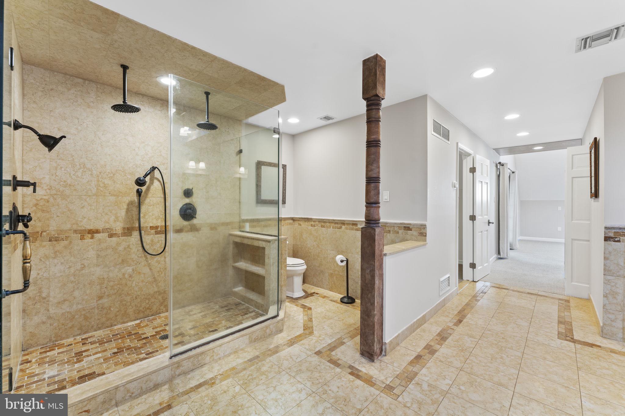 244 Mathers Road Ambler, PA 19002 - Photo 31 of 52 a bathroom with a glass shower door and a glass door