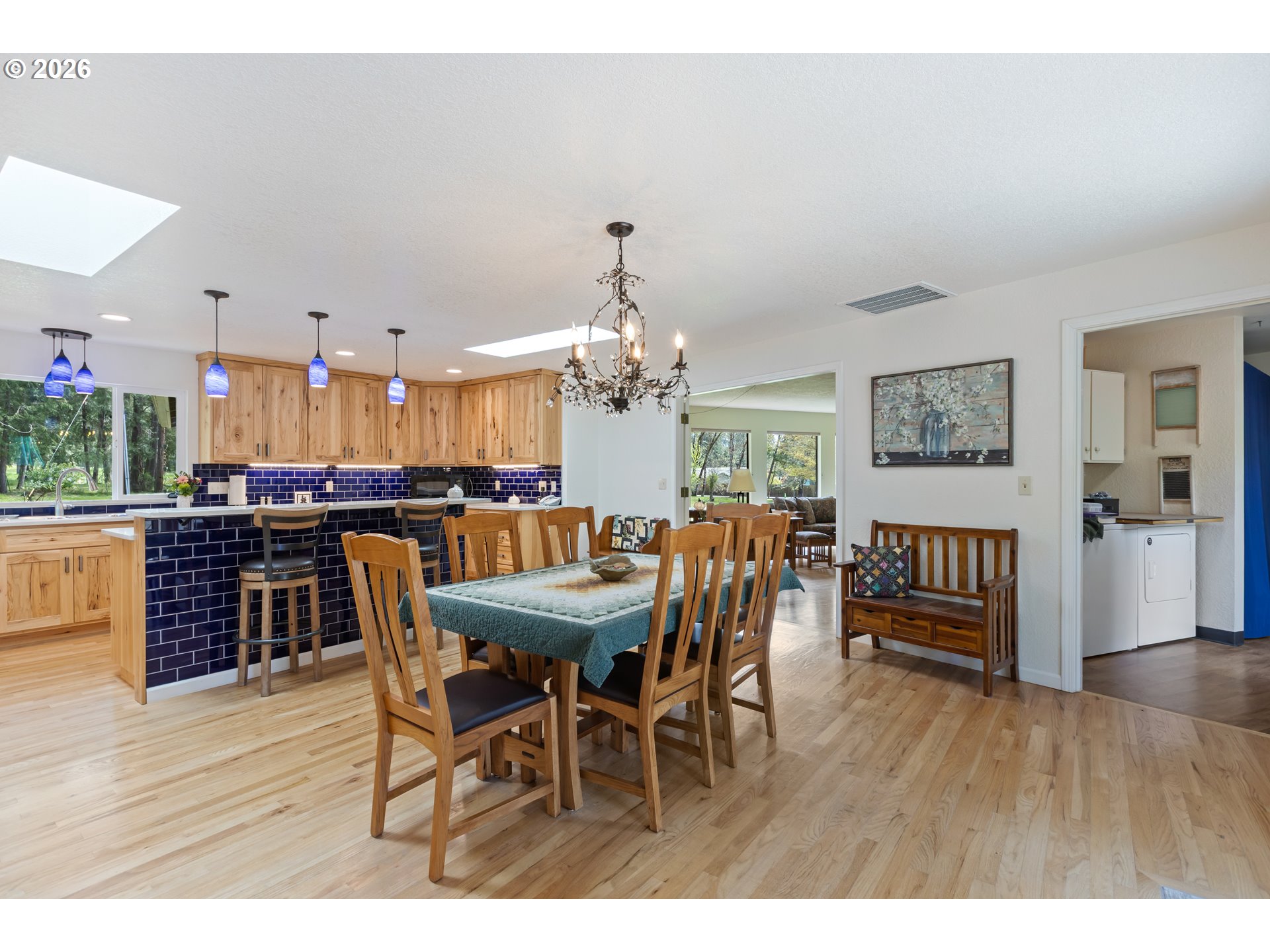 738 Elgarose Road Roseburg, OR 97471 - Photo 12 of 48 a view of a dining room with furniture and wooden floor