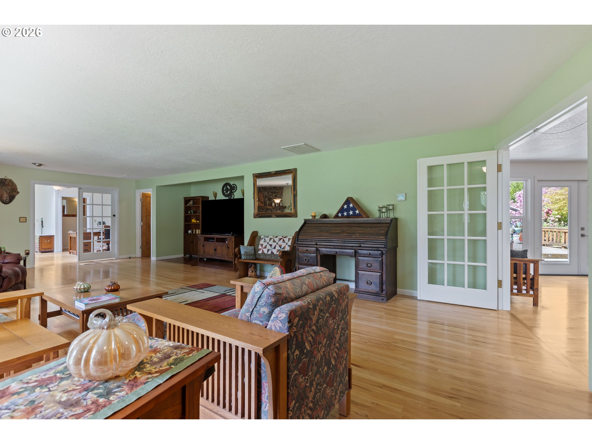 738 Elgarose Road Roseburg, OR 97471 - Photo 14 of 48 a living room with furniture a flat screen tv and a fireplace