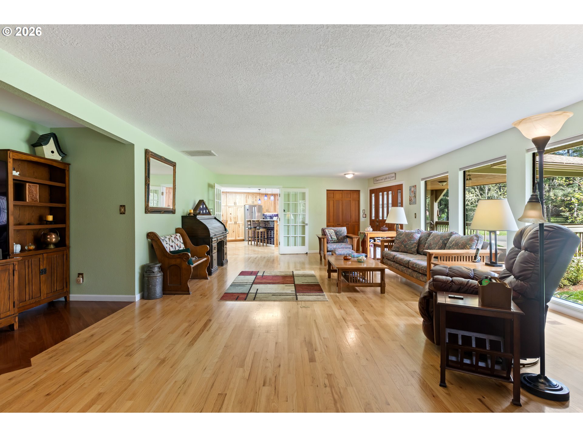 738 Elgarose Road Roseburg, OR 97471 - Photo 16 of 48 a living room with furniture a dining table and wooden floor