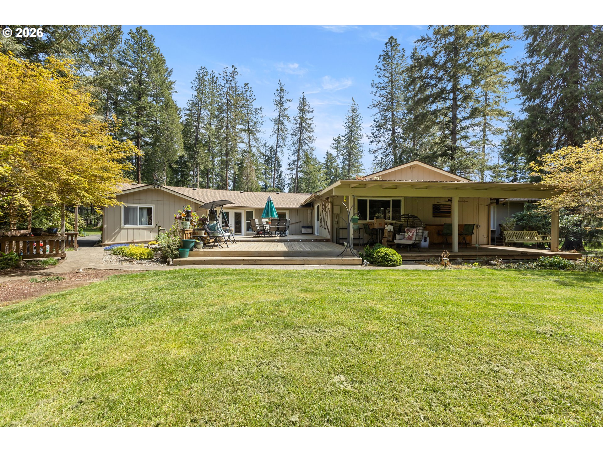 738 Elgarose Road Roseburg, OR 97471 - Photo 38 of 48 a front view of a house with swimming pool having outdoor seating