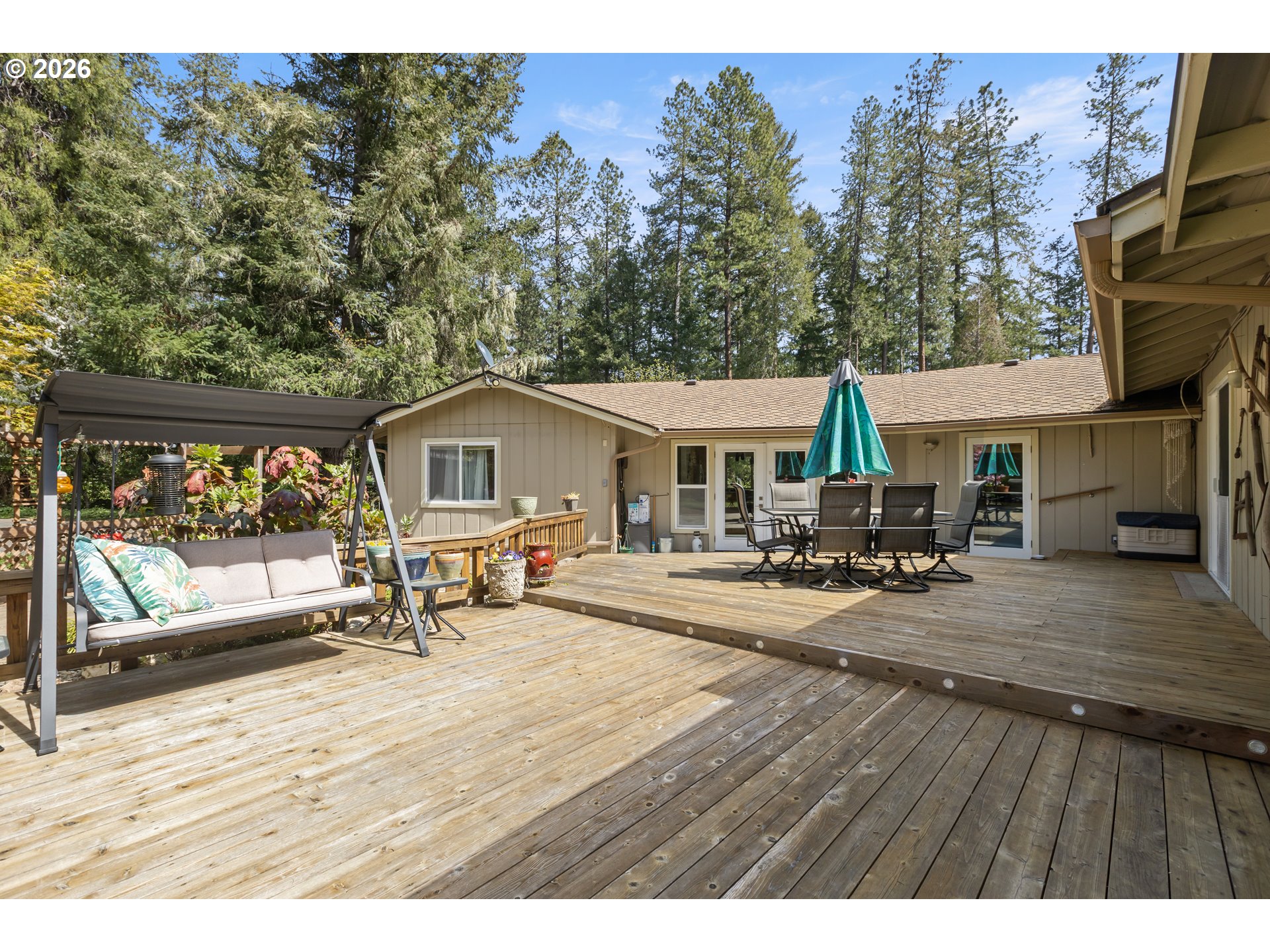 738 Elgarose Road Roseburg, OR 97471 - Photo 39 of 48 a view of house with wooden deck and seating space