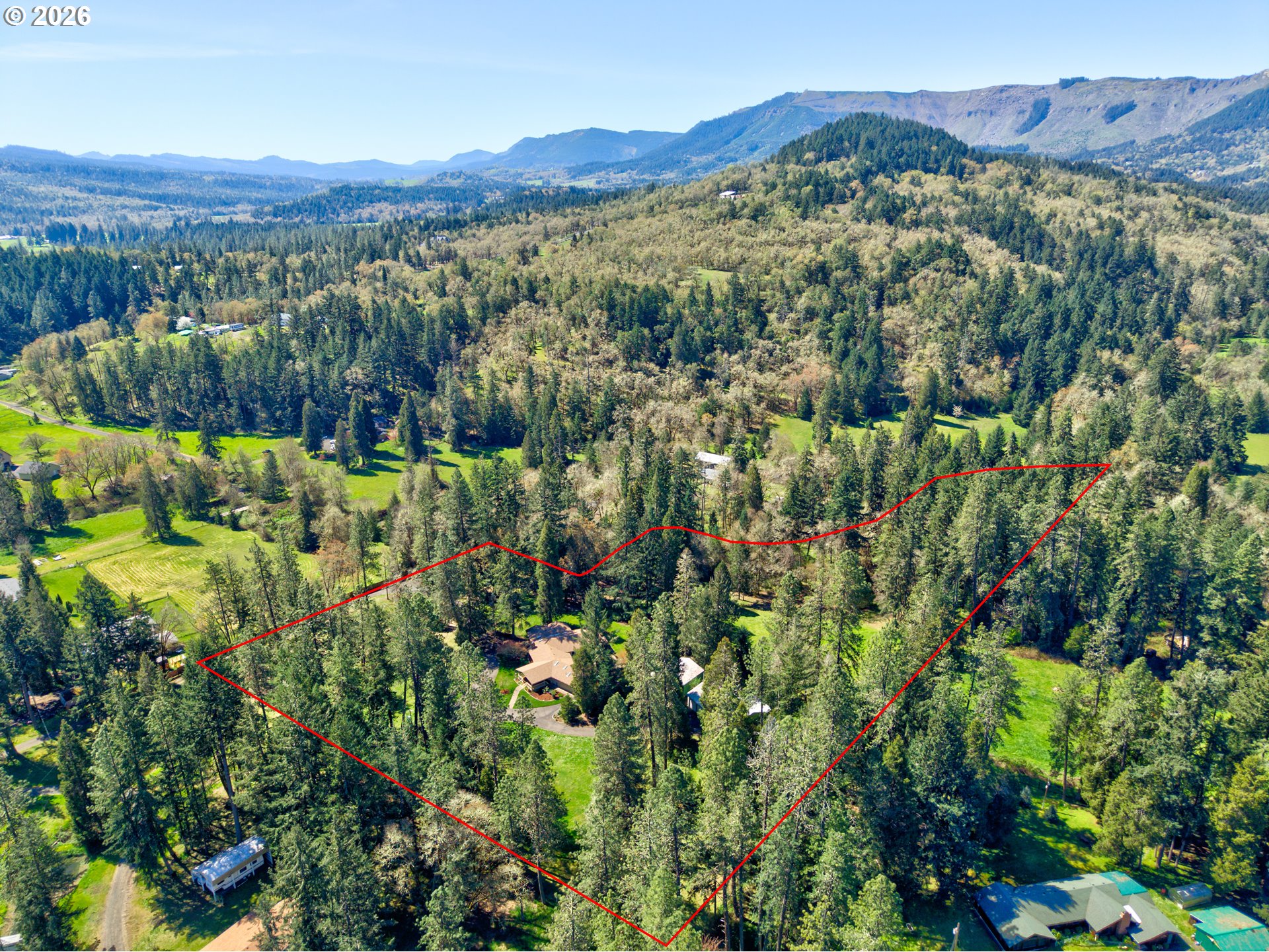 738 Elgarose Road Roseburg, OR 97471 - Photo 44 of 48 a view of a lush green hillside and houses