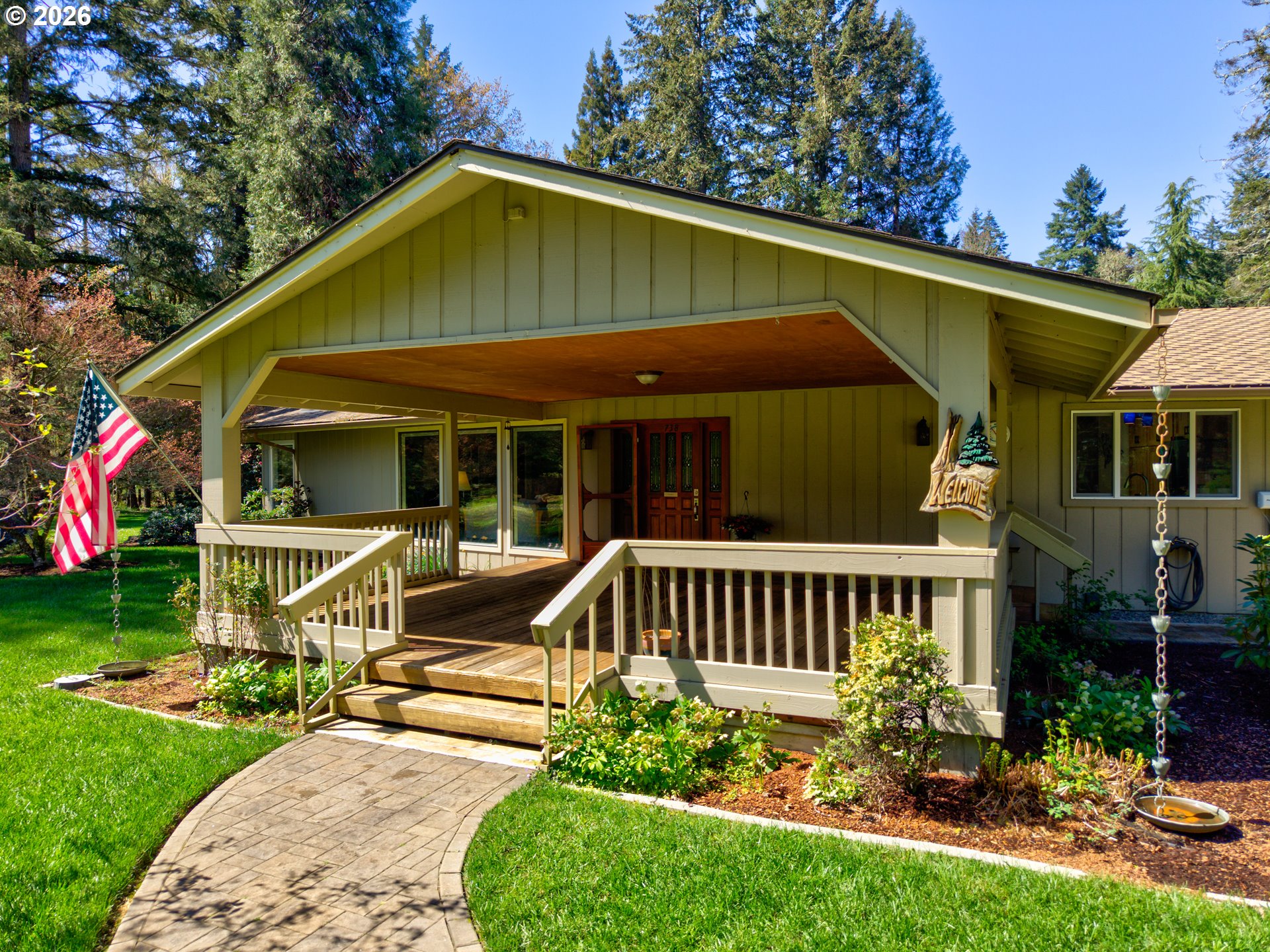 738 Elgarose Road Roseburg, OR 97471 - Photo 6 of 48 a front view of a house with garden