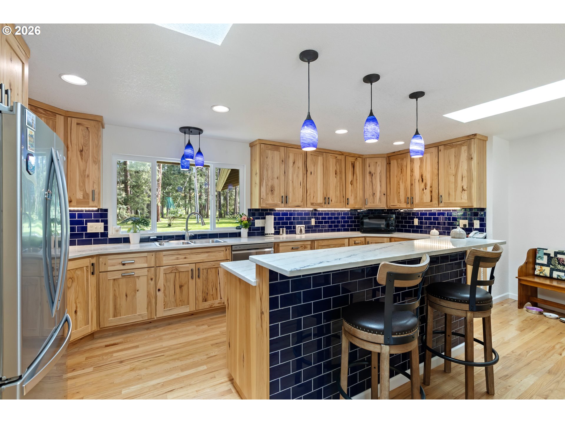 738 Elgarose Road Roseburg, OR 97471 - Photo 9 of 48 a kitchen with a table and chairs in it