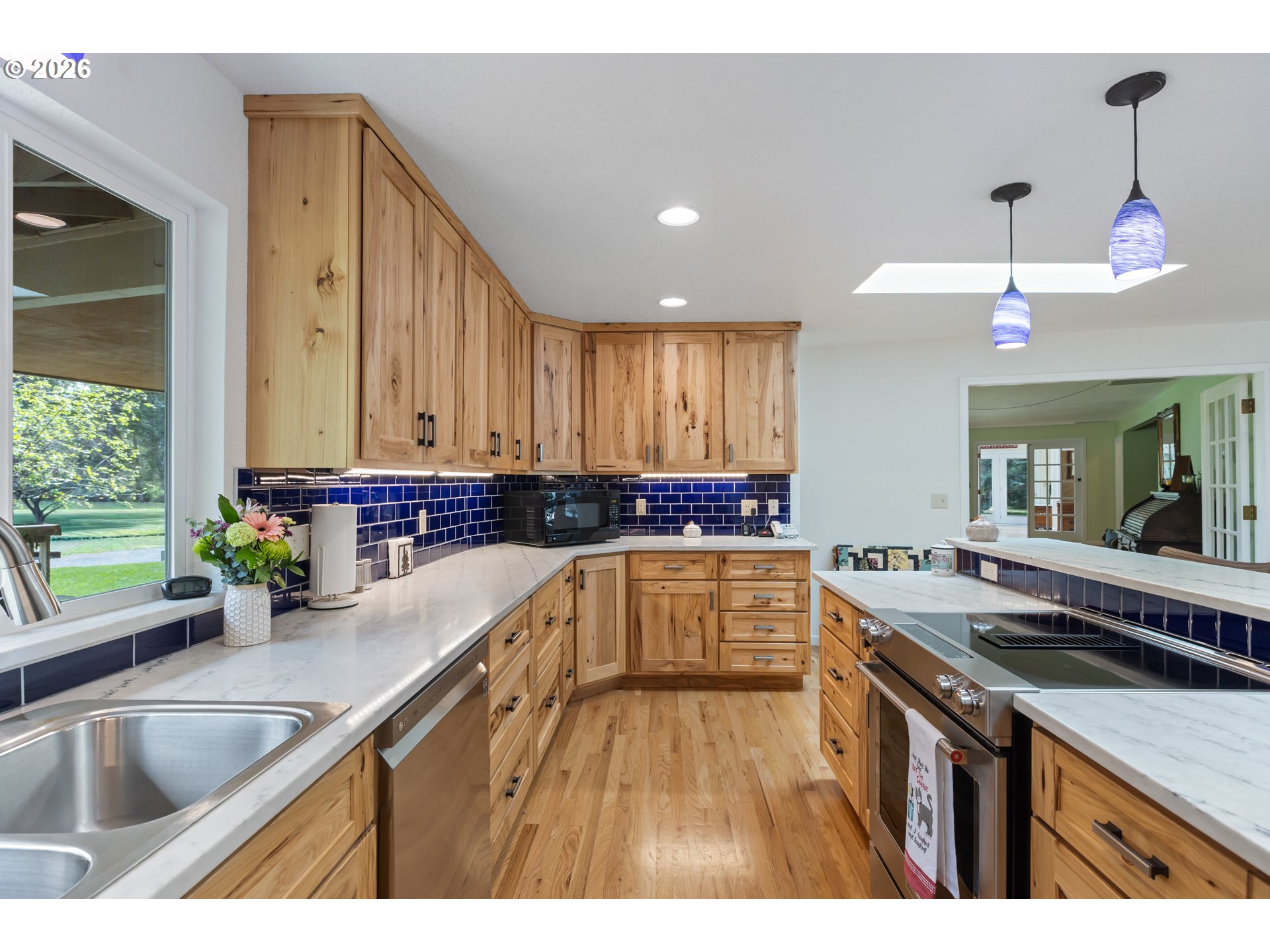 738 Elgarose Road Roseburg, OR 97471 - Photo 10 of 48 a kitchen with a sink stove and cabinets