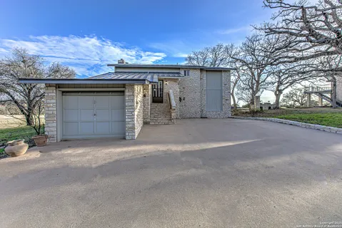 a view of a house with a outdoor space and garage
