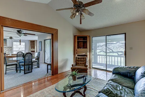 a bed sitting in a spacious bedroom next to a window
