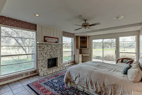 a bedroom with double bed and a rug
