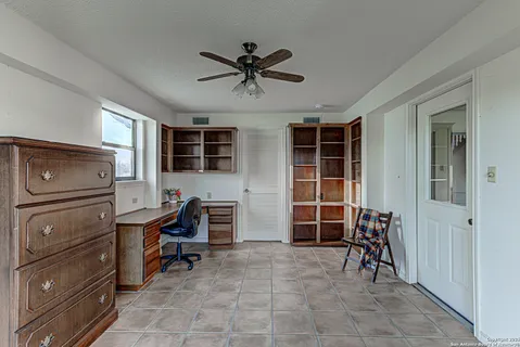 a workspace with furniture and window