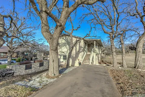 a view of a porch and garden