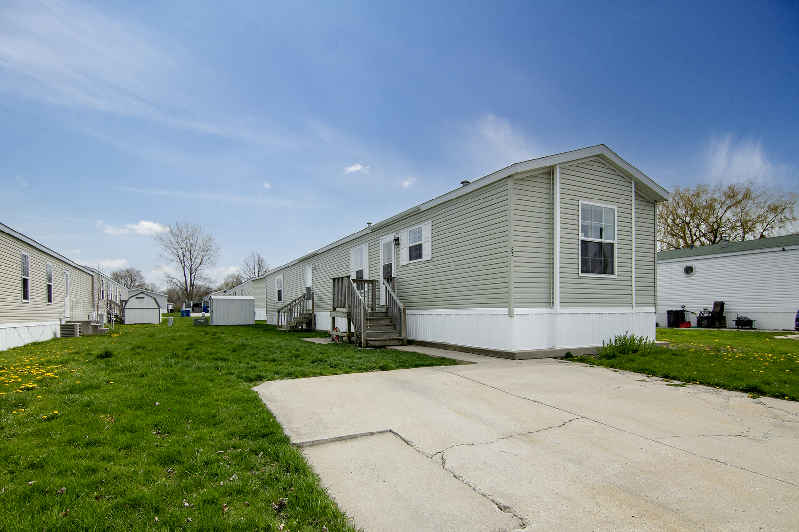 25 St Francis Drive Bourbonnais, IL 60914 - Photo 1 of 11 a front view of a house with a yard and garage