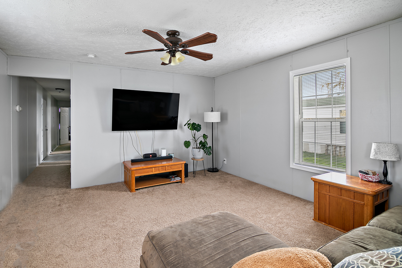 25 St Francis Drive Bourbonnais, IL 60914 - Photo 2 of 11 a living room with furniture and a flat screen tv