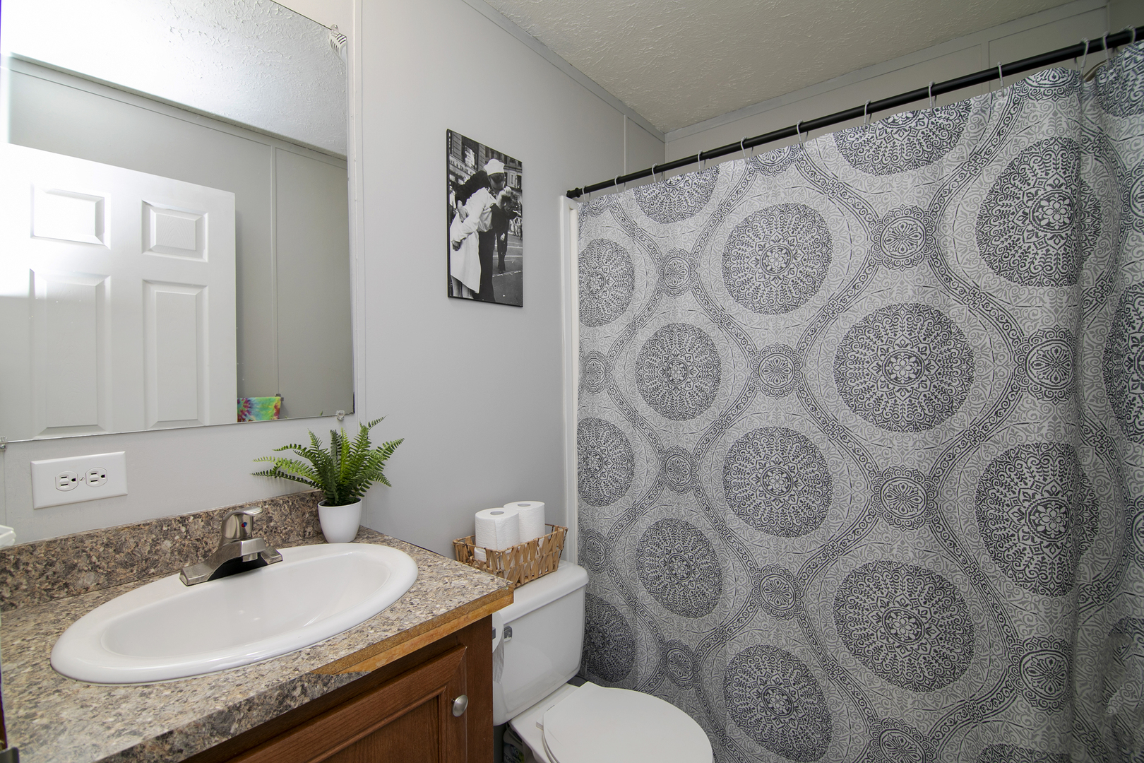 25 St Francis Drive Bourbonnais, IL 60914 - Photo 9 of 11 a bathroom with a granite countertop toilet sink and mirror