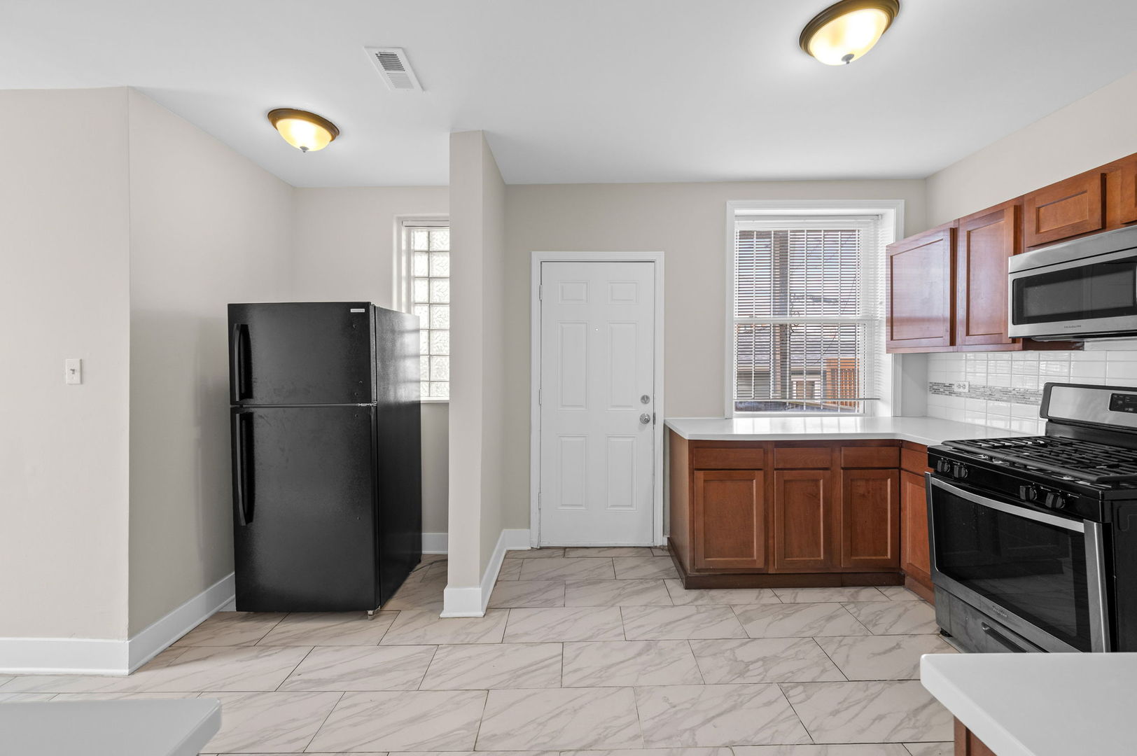 2756 West Monroe Street Chicago, IL 60612 - Photo 12 of 52 a kitchen with stainless steel appliances granite countertop a refrigerator oven a sink and dishwasher