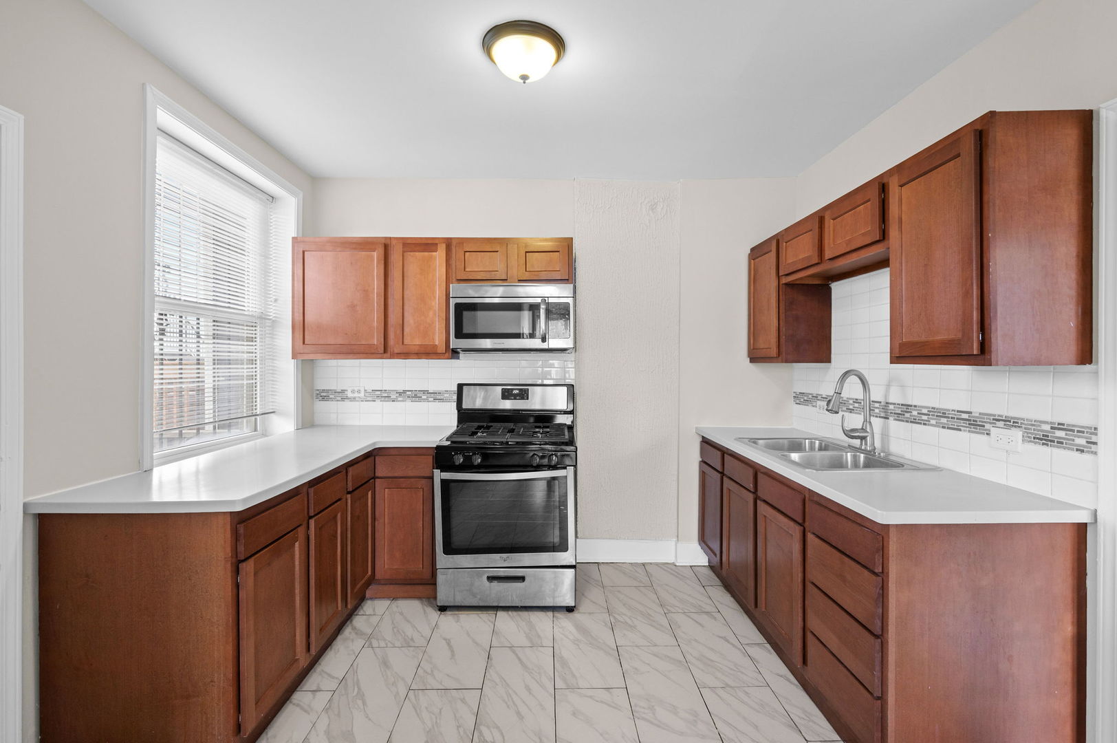 2756 West Monroe Street Chicago, IL 60612 - Photo 14 of 52 a kitchen with stainless steel appliances a sink stove and cabinets