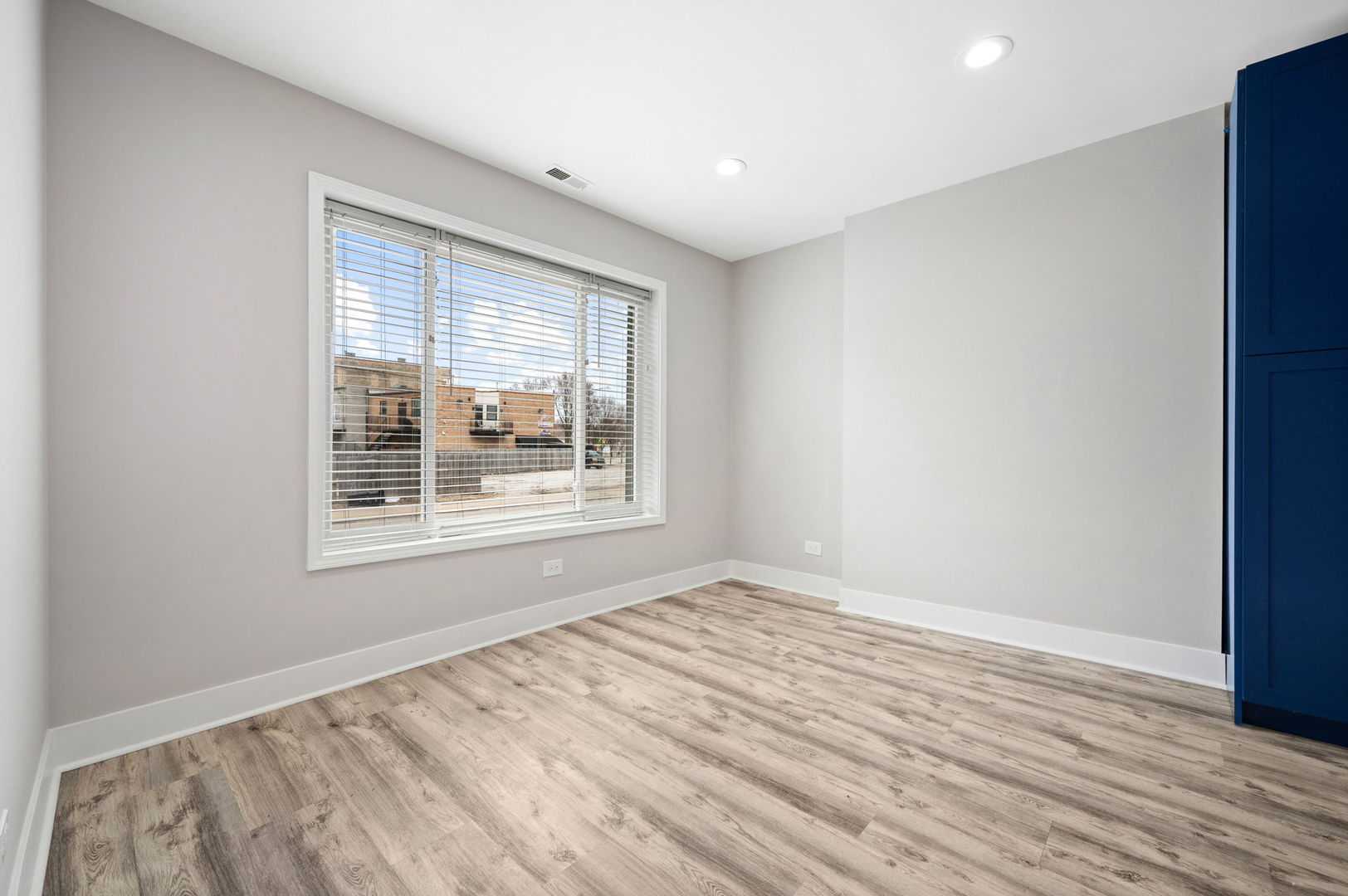 2756 West Monroe Street Chicago, IL 60612 - Photo 21 of 52 a view of an empty room with wooden floor and a window