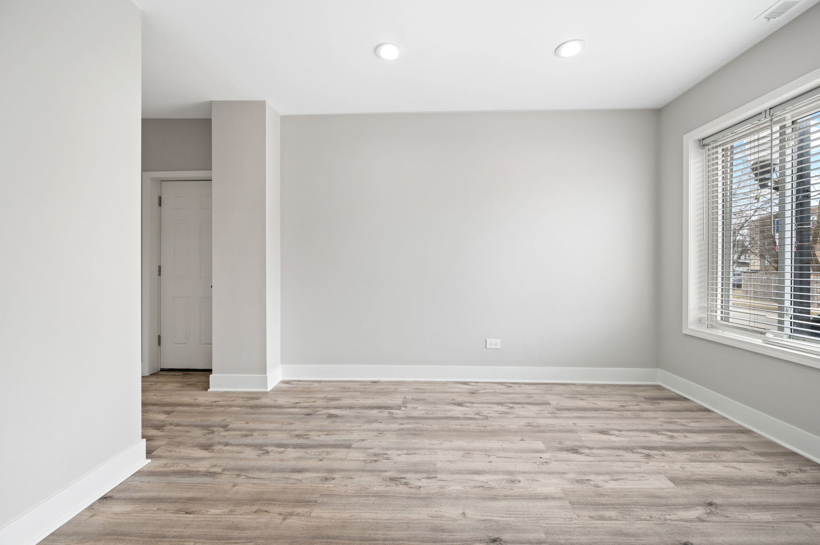 2756 West Monroe Street Chicago, IL 60612 - Photo 28 of 52 an empty room with wooden floor and windows