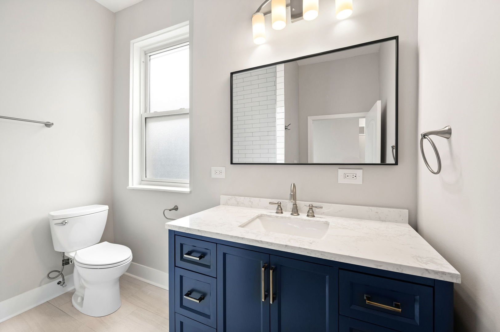 2756 West Monroe Street Chicago, IL 60612 - Photo 37 of 52 a bathroom with a toilet sink and mirror